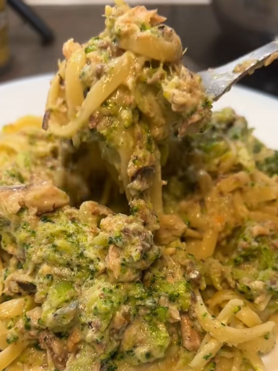 Forkful of linguine in a creamy broccoli and sardine sauce