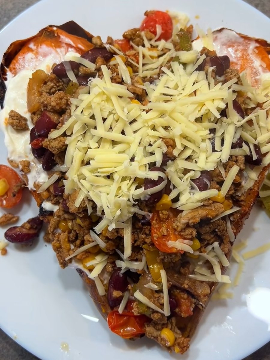 A split sweet potato loaded with turkey chilli, kidney beans, sweetcorn, cherry tomatoes, Greek yoghurt and grated cheddar
